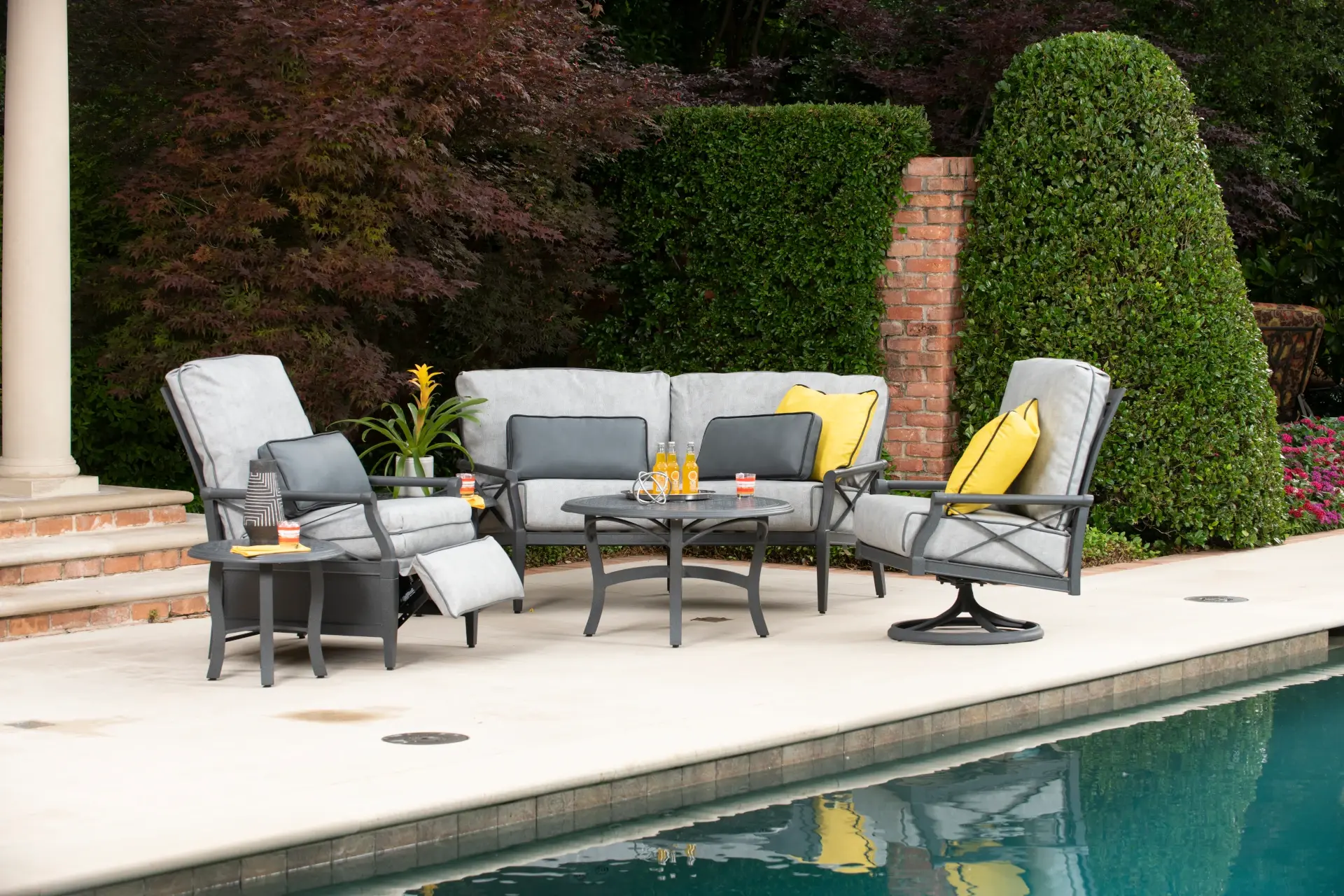 outside chairs and seating and table by pool