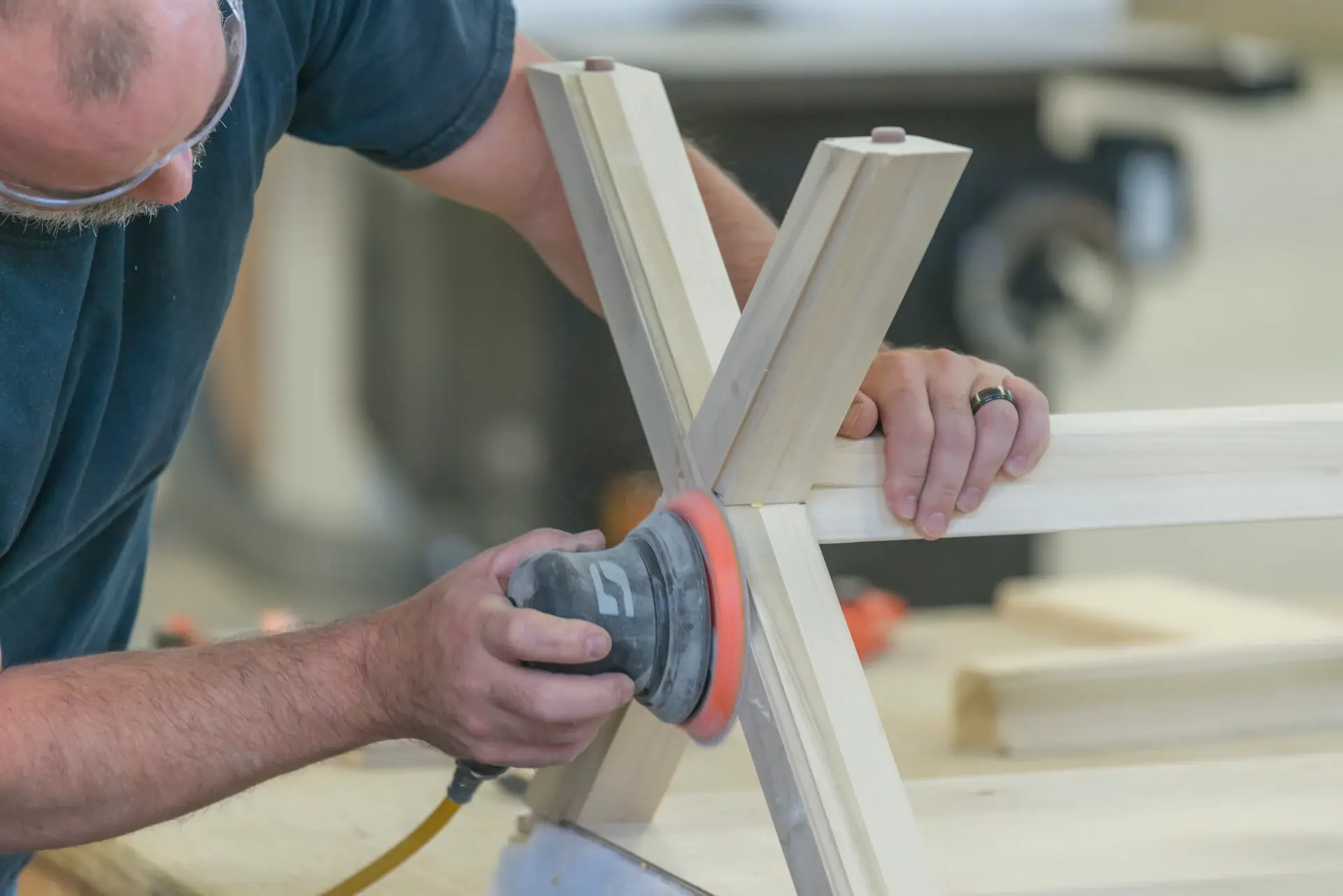 homestead factory worker sanding wood