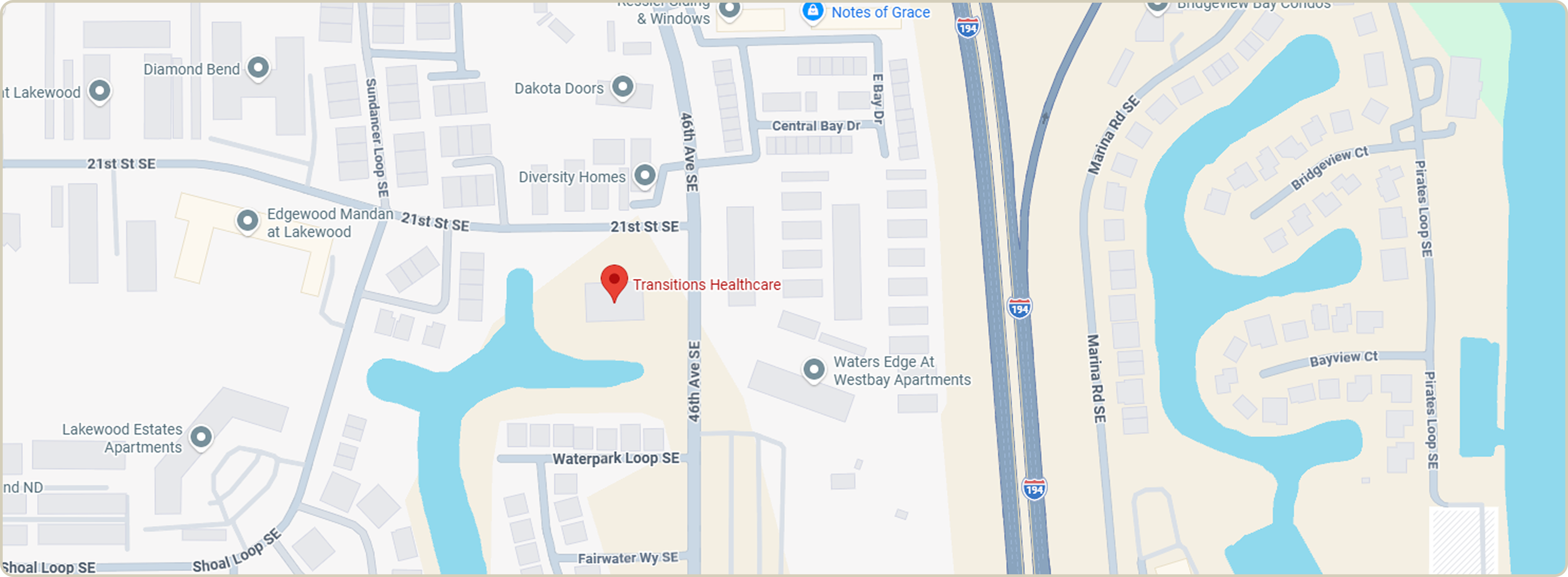 Map highlighting Transitions Healthcare near 46th Ave SE and 21st St SE, surrounded by residential areas and waterways.