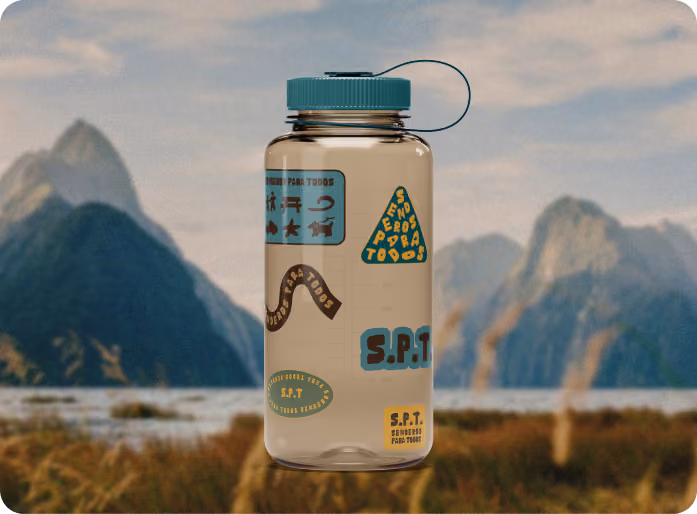 Senderos Para Todos stickers on a Nalgene bottle against the mountains