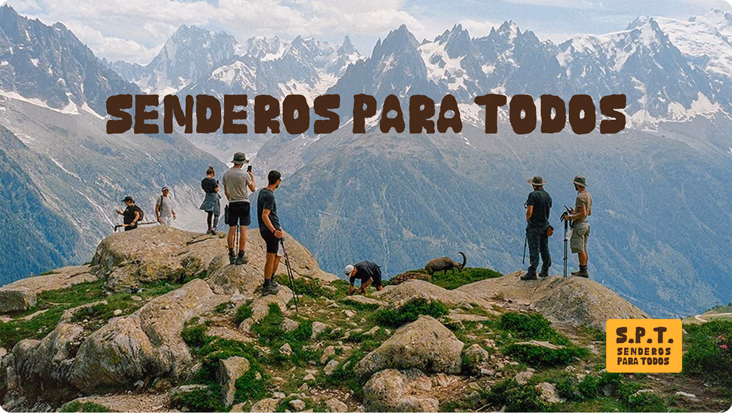 Senderistas en una cima rocosa con el logotipo S.P.T.