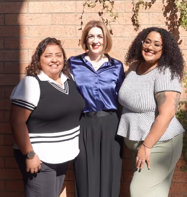 Three attendees posing at the NALCAB event