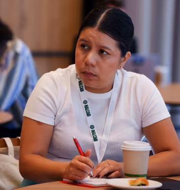Attendee taking notes at the NALCAB conference