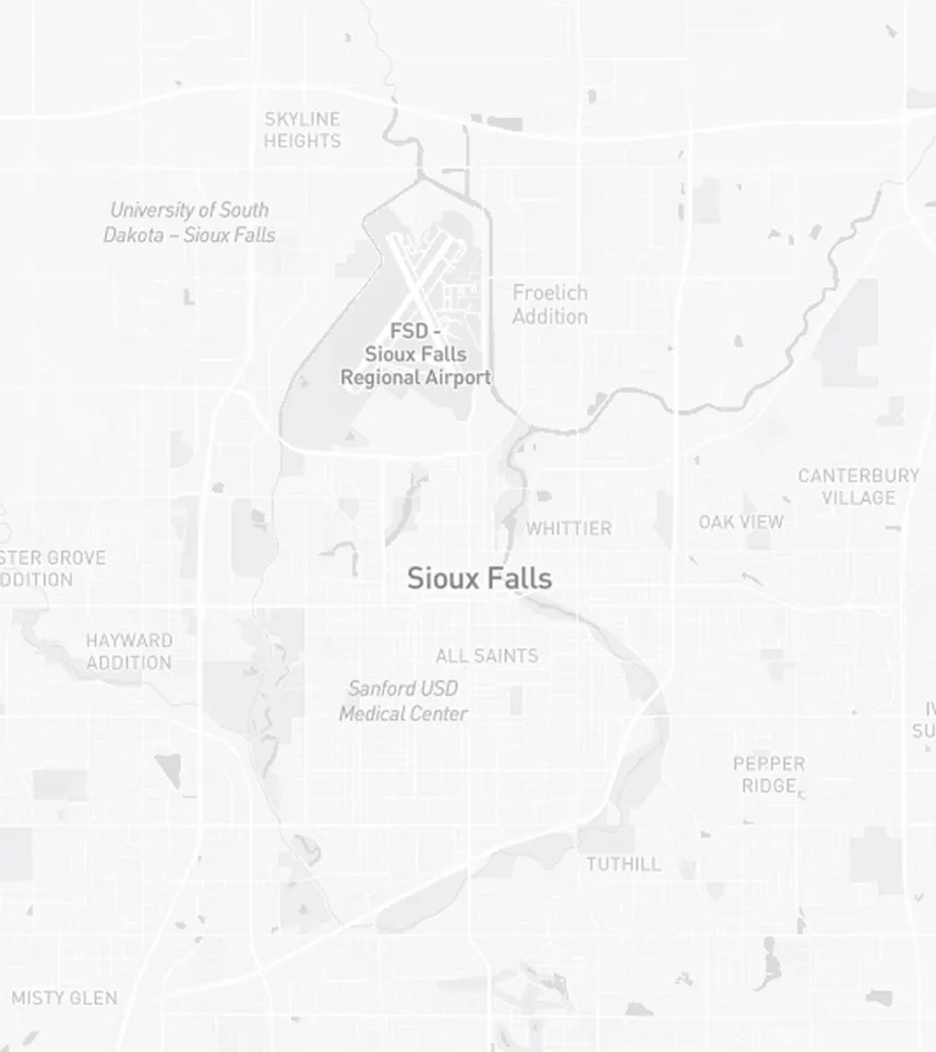 Map of Sioux Falls showing neighborhoods and landmarks including FSD Sioux Falls Regional Airport, University of South Dakota, Sanford USD Medical Center, and areas like Skyline Heights, Froelich Addition, All Saints, Whittier, Oak View, Canterbury Village, and Pepper Ridge.