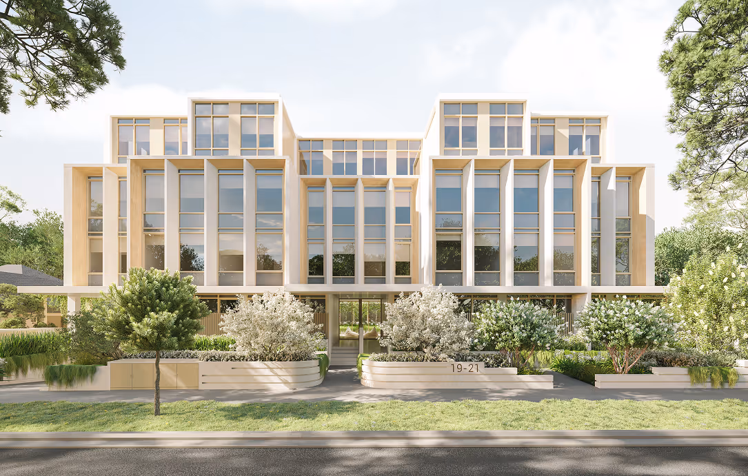 Modern multi-story residential building with large vertical windows, surrounded by landscaped greenery and trees.