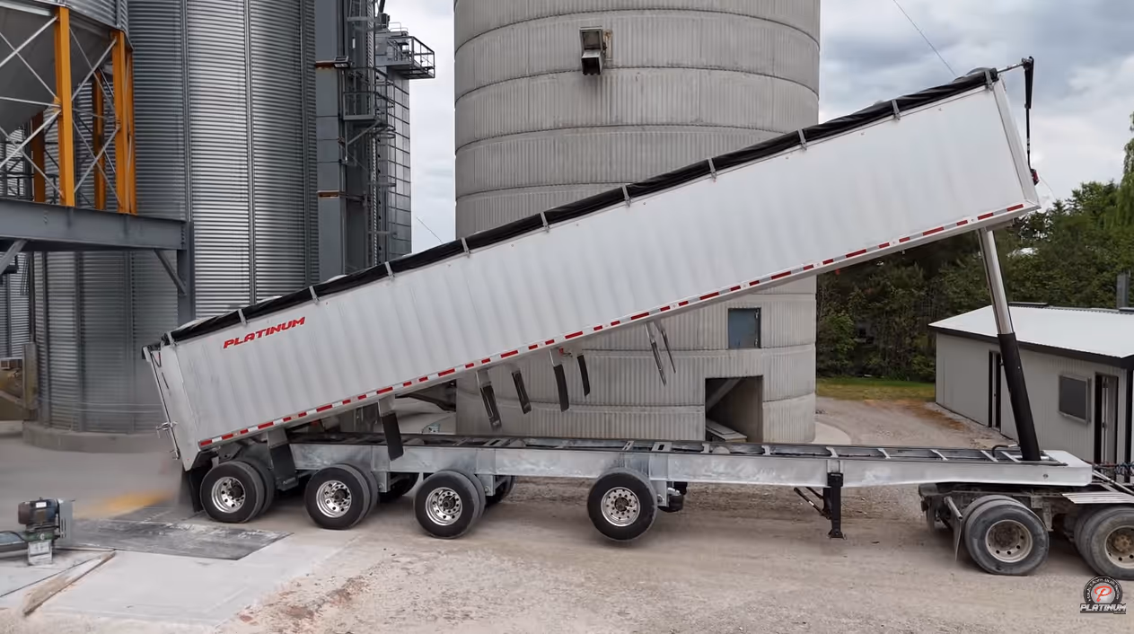 4 axle dump trailer at a grain elevator unloading