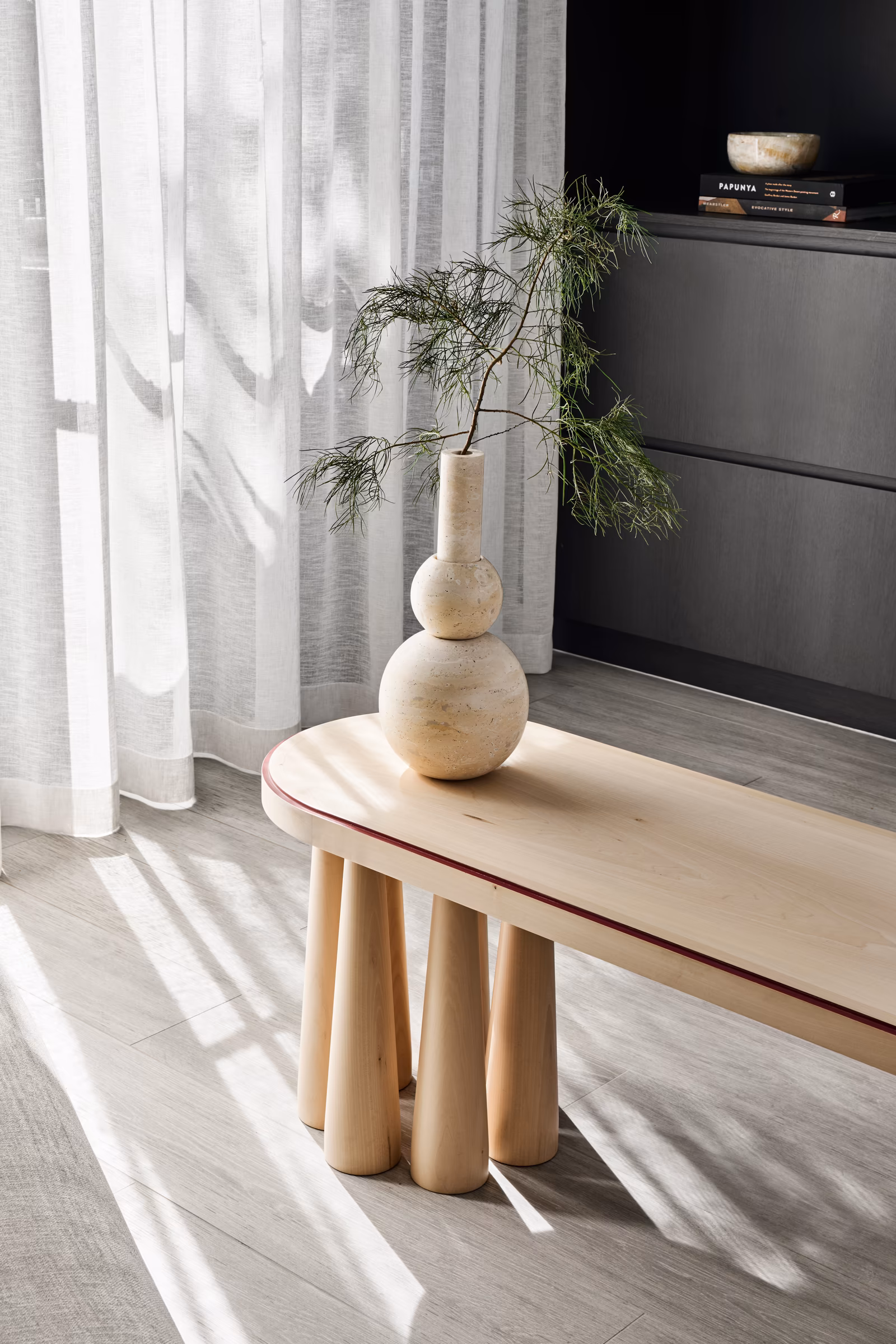 timber bench with stone vase and foliage beside sheer curtains and dark joinery, opus 4, thornbury