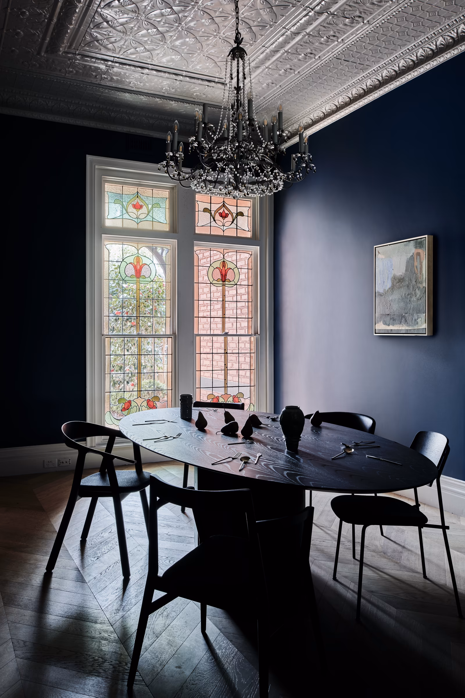 dining room with navy walls, pressed-metal ceiling, chandelier and leadlight windows, opus 73, middle park