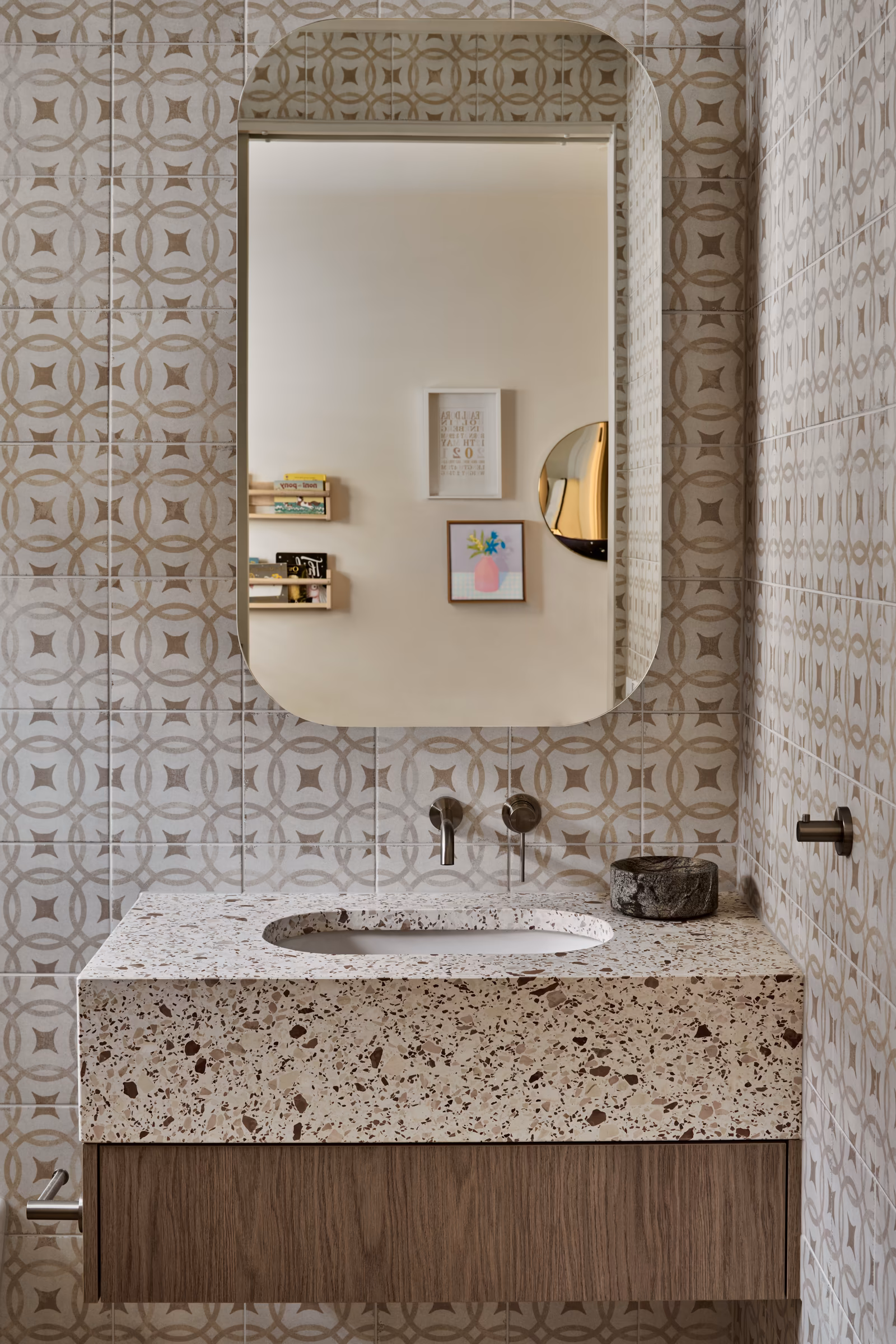 bathroom with patterned wall tiles, terrazzo vanity and rounded mirror, opus 5, caulfield north