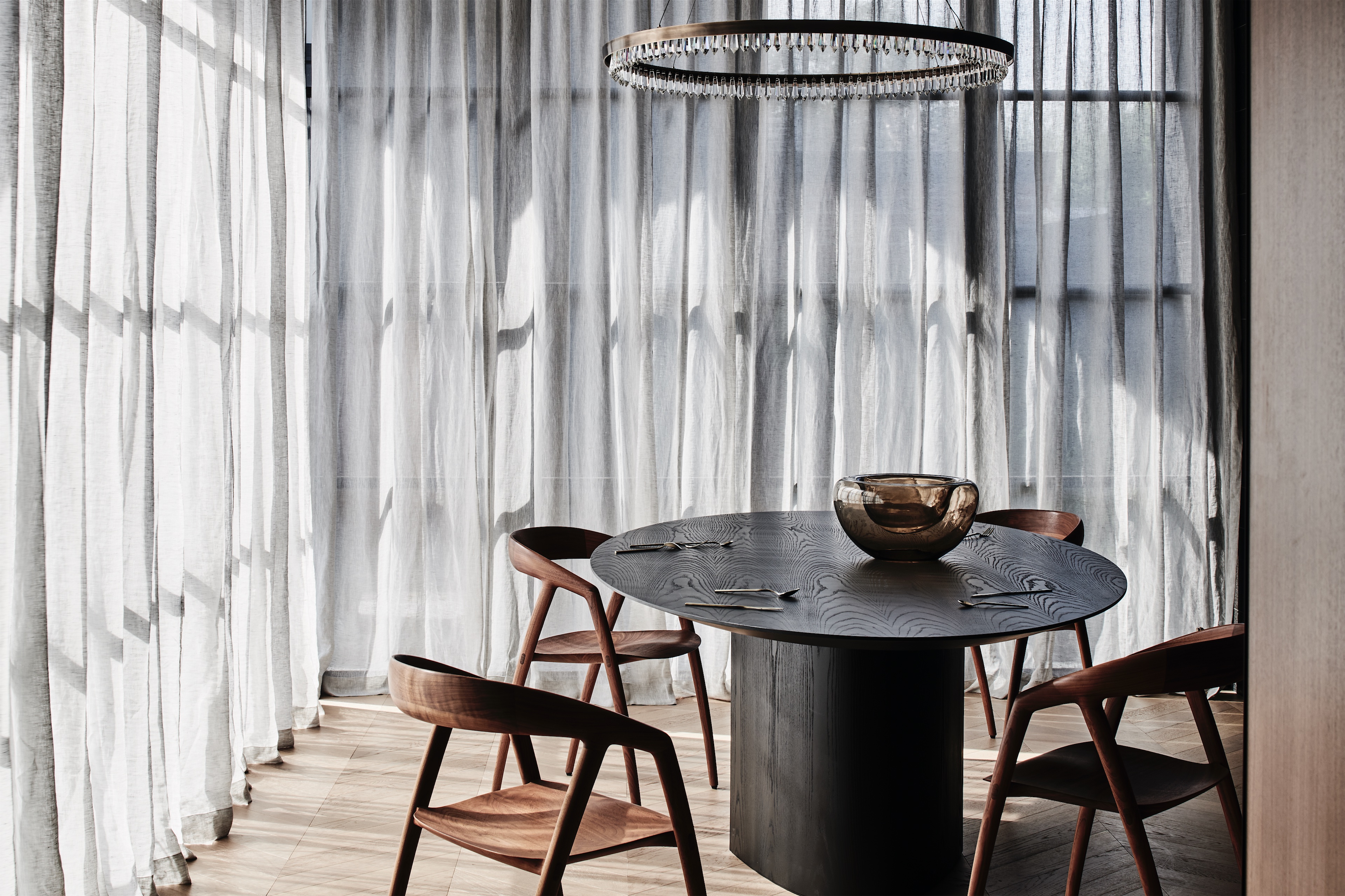 dining nook with round dark timber table, timber chairs and sheer curtains, opus 73, middle park