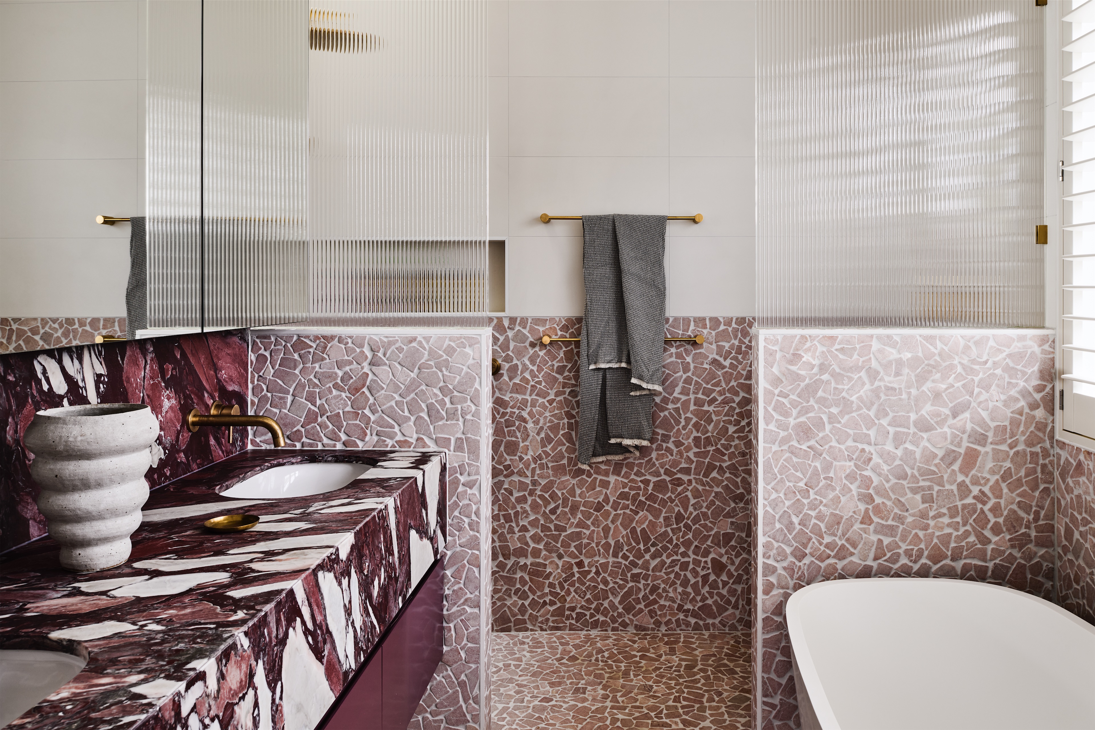 bathroom with burgundy veined stone vanity, pink stone mosaic walls and fluted glass, opus 5, caulfield north