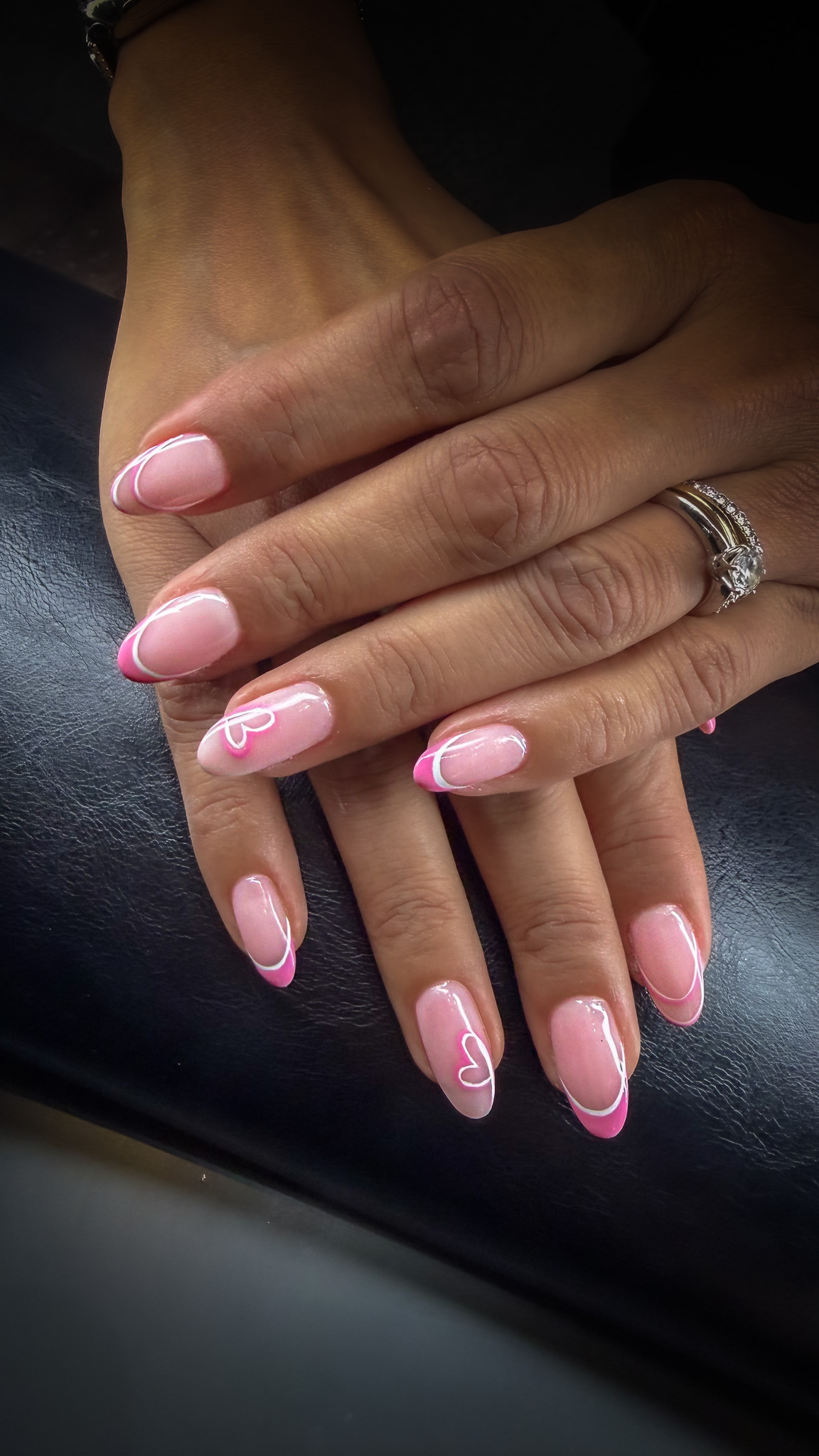 Pink French gel manicure with outlined heart nail art, Dubai nail salon March14