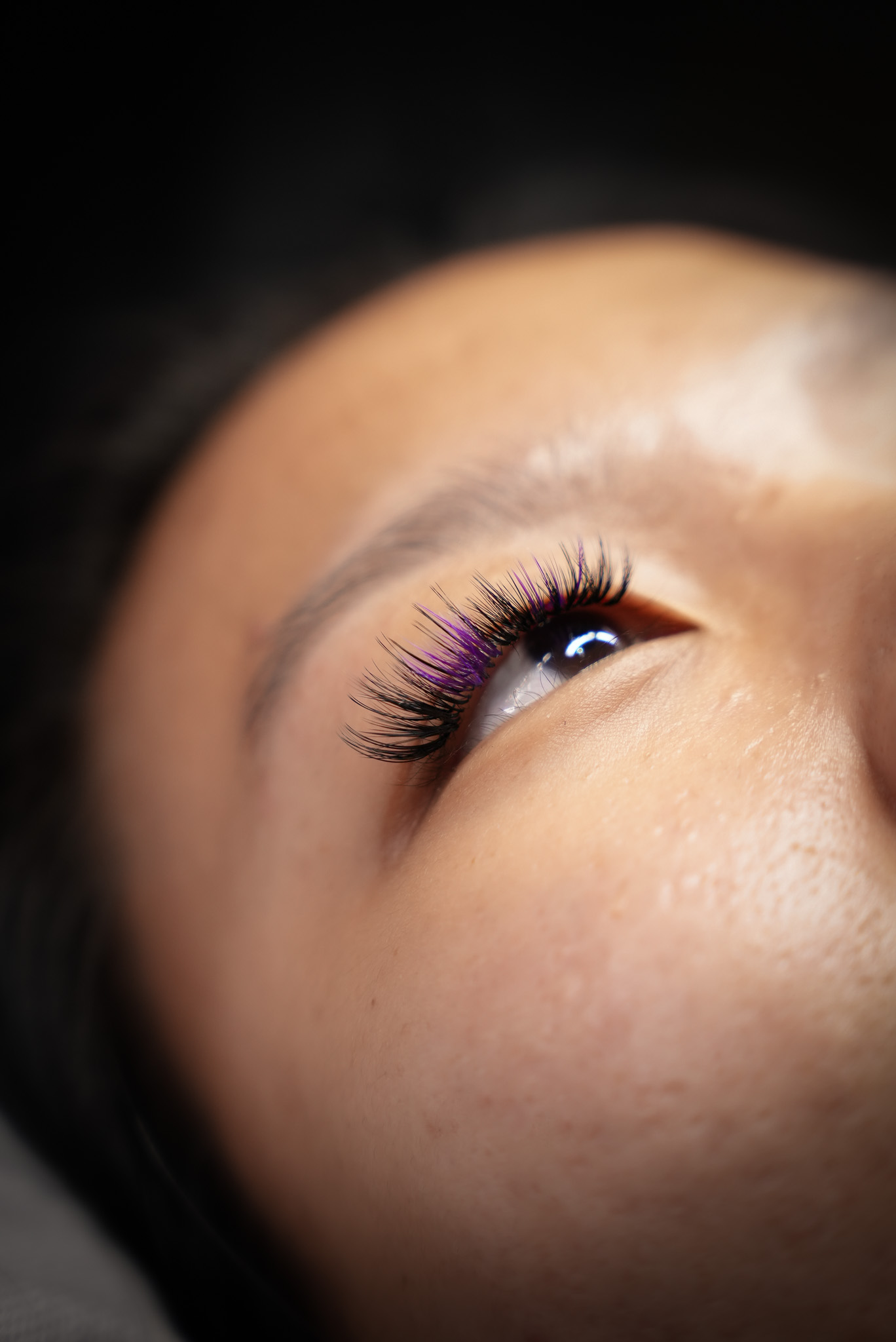 Creative purple coloured lash extensions close up at March14 Beauty Residence Dubai