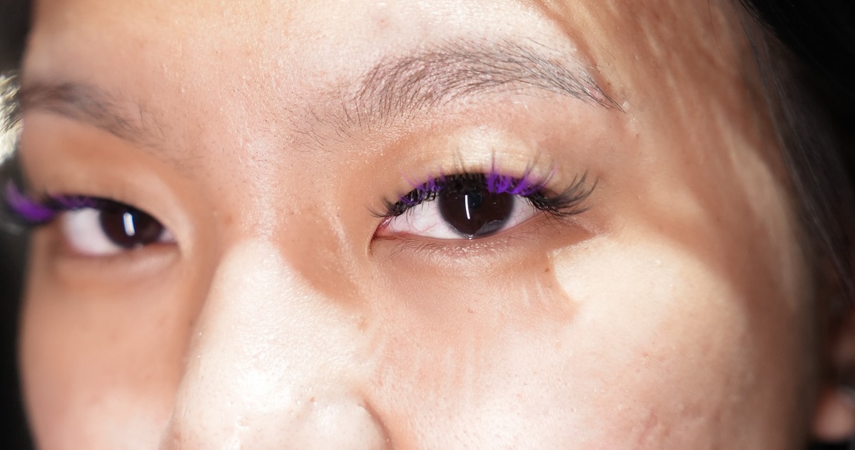Colourful lash extensions on an open eye, creative lashes at March14 Beauty Residence Dubai