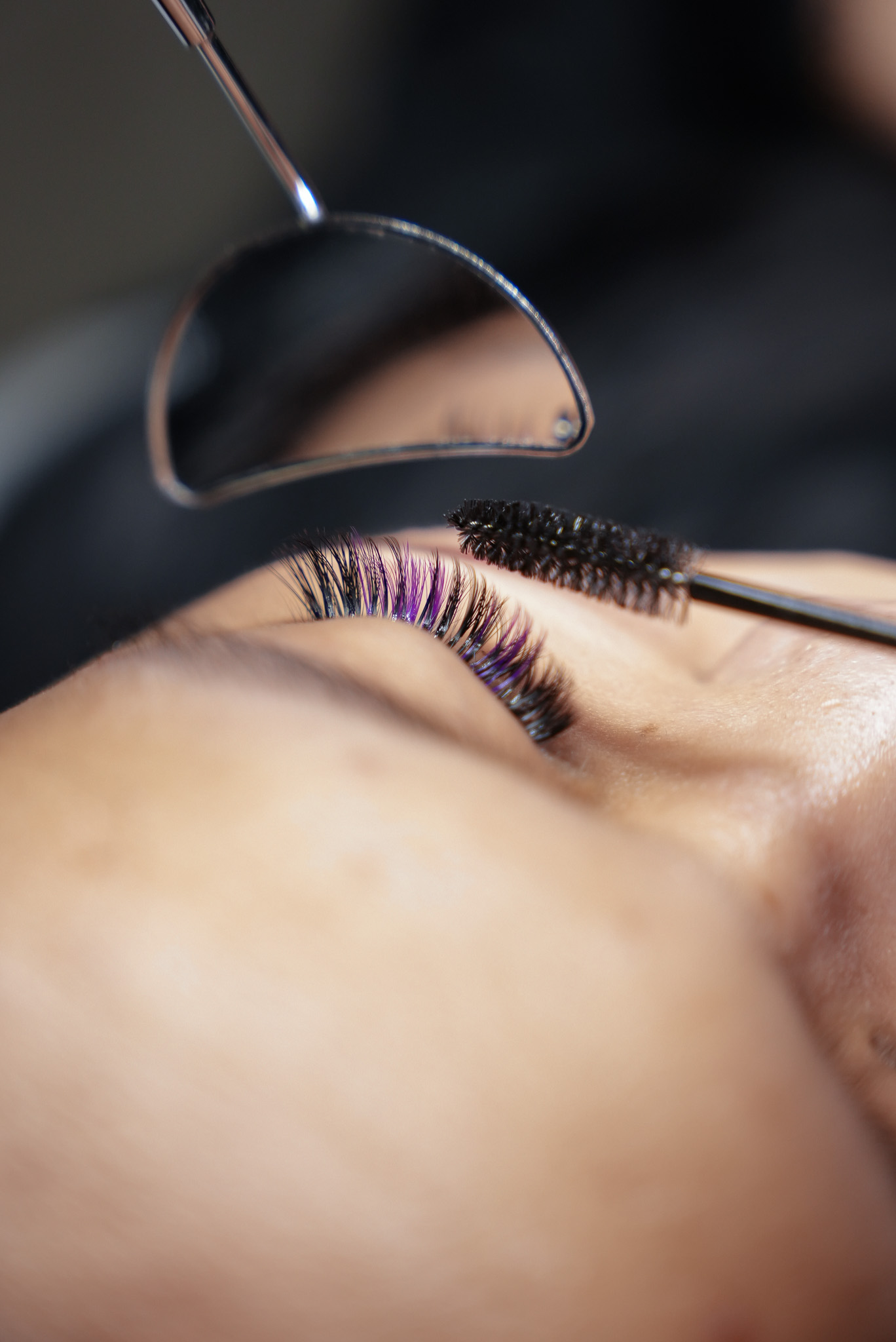 Coloured lash extensions brushed through during a creative lash set in Dubai