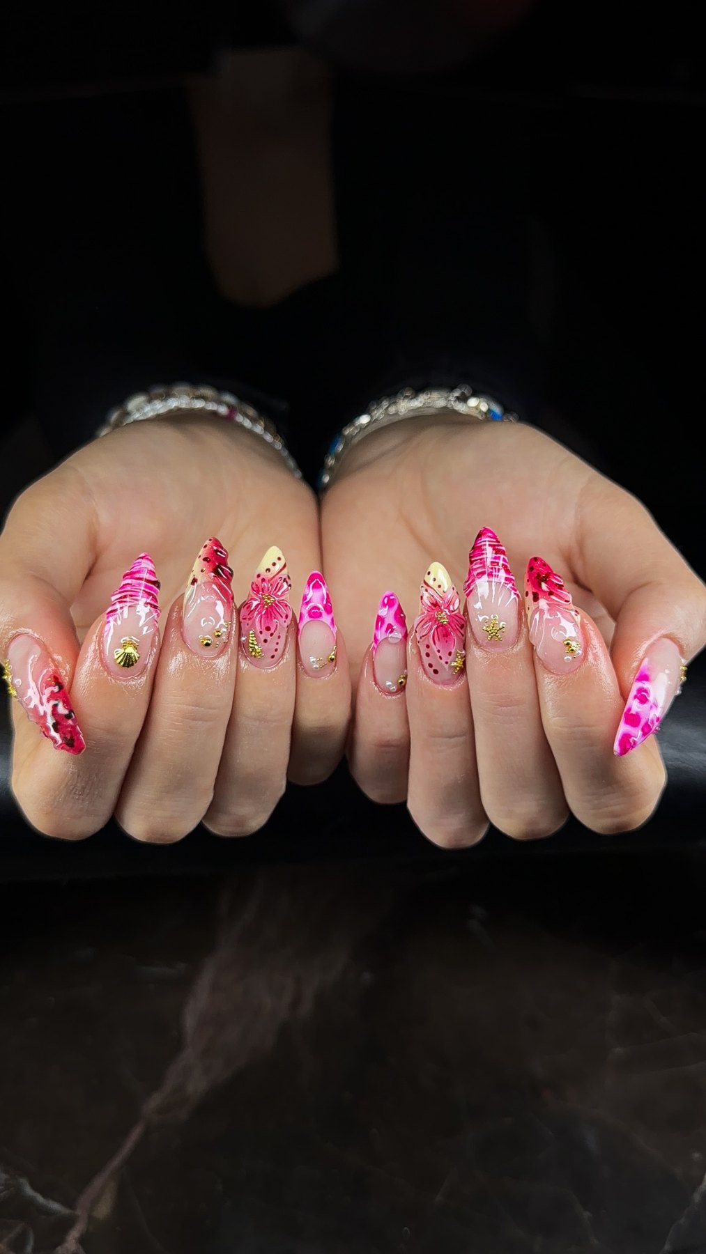 Tropical pink nail art with hibiscus flowers, leopard print and gold seashell charms, Dubai nail salon March14