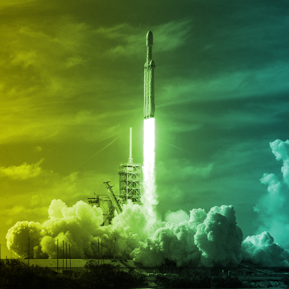 Falcon Heavy rocket launch representing the scale and momentum of iAccelerate frontier technology.