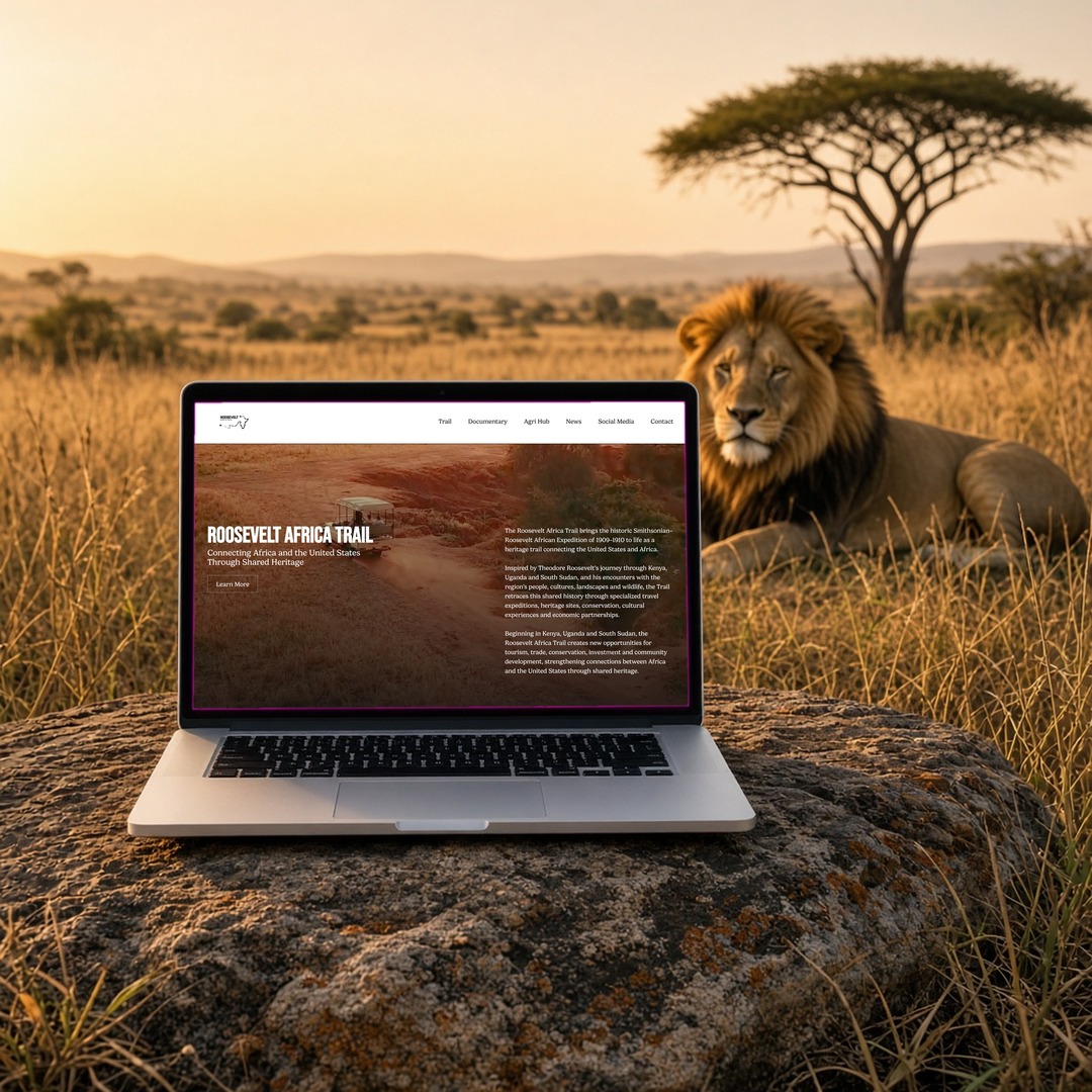 Roosevelt Africa Trail homepage on a laptop resting on a rock in the savannah with a lion behind, showing layout and design