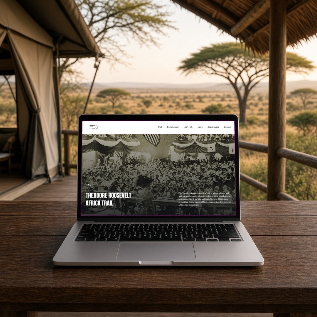 Roosevelt Africa Trail Agri Hub page on a laptop on a safari lodge veranda, showing layout and design