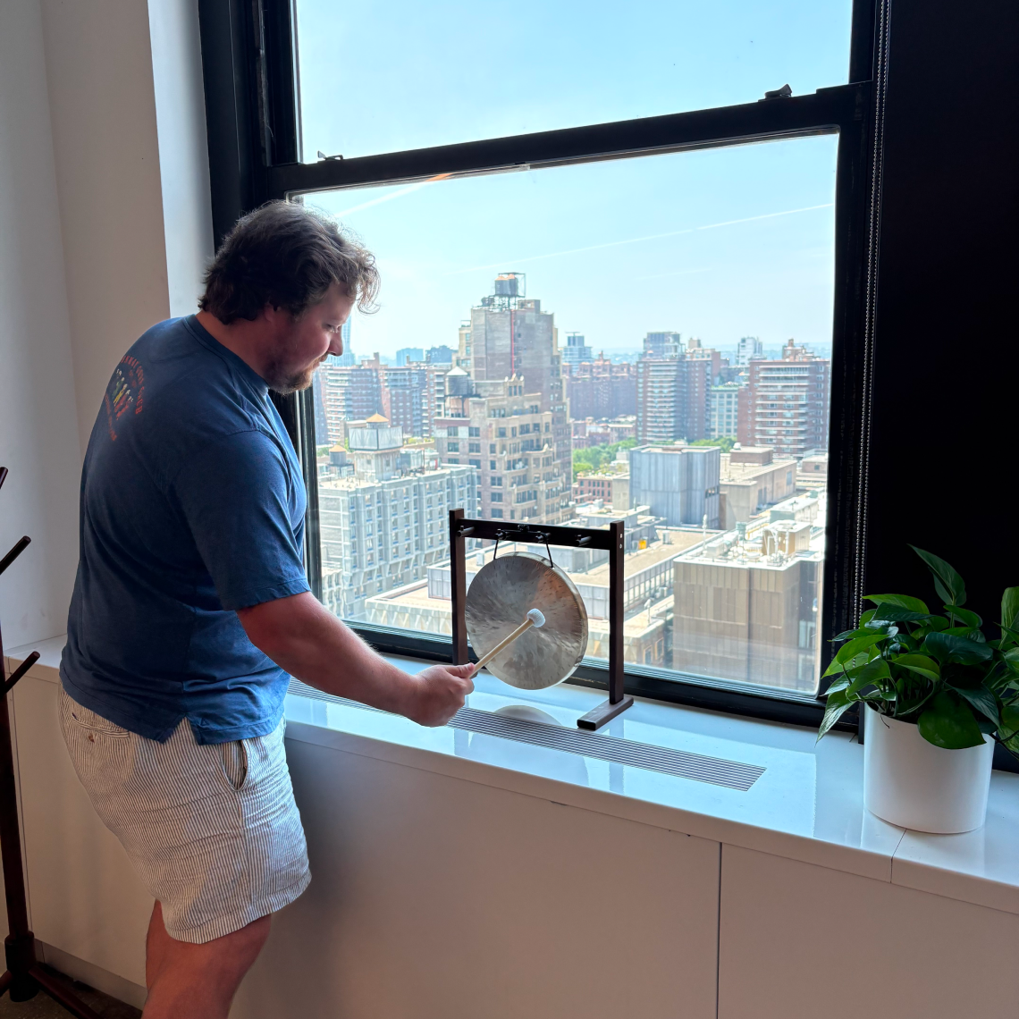 Team member ringing the office gong