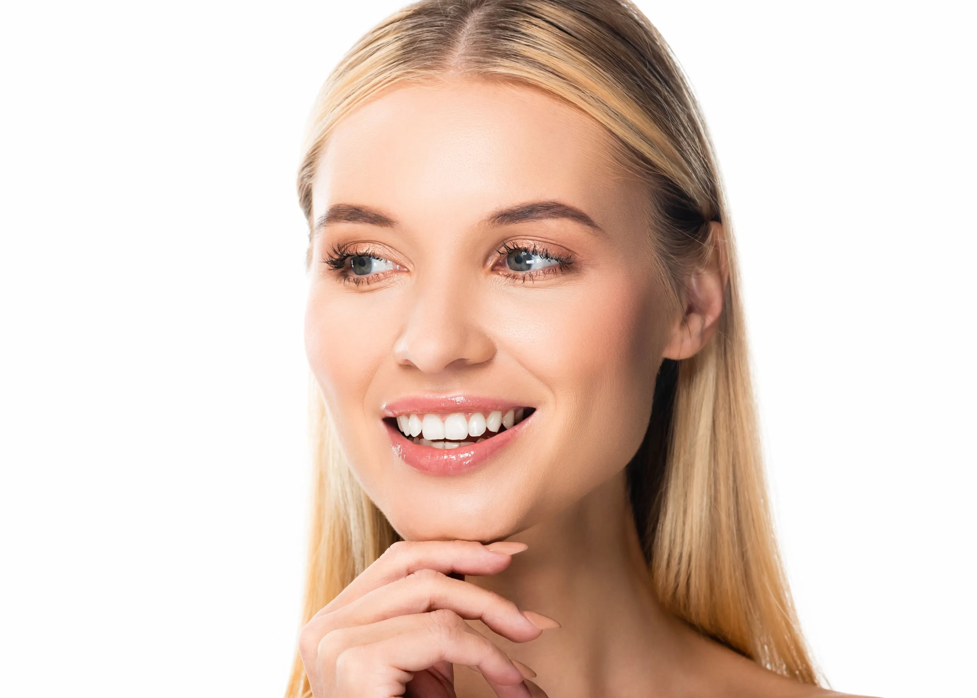 A woman with long blonde hair smiles at the camera.