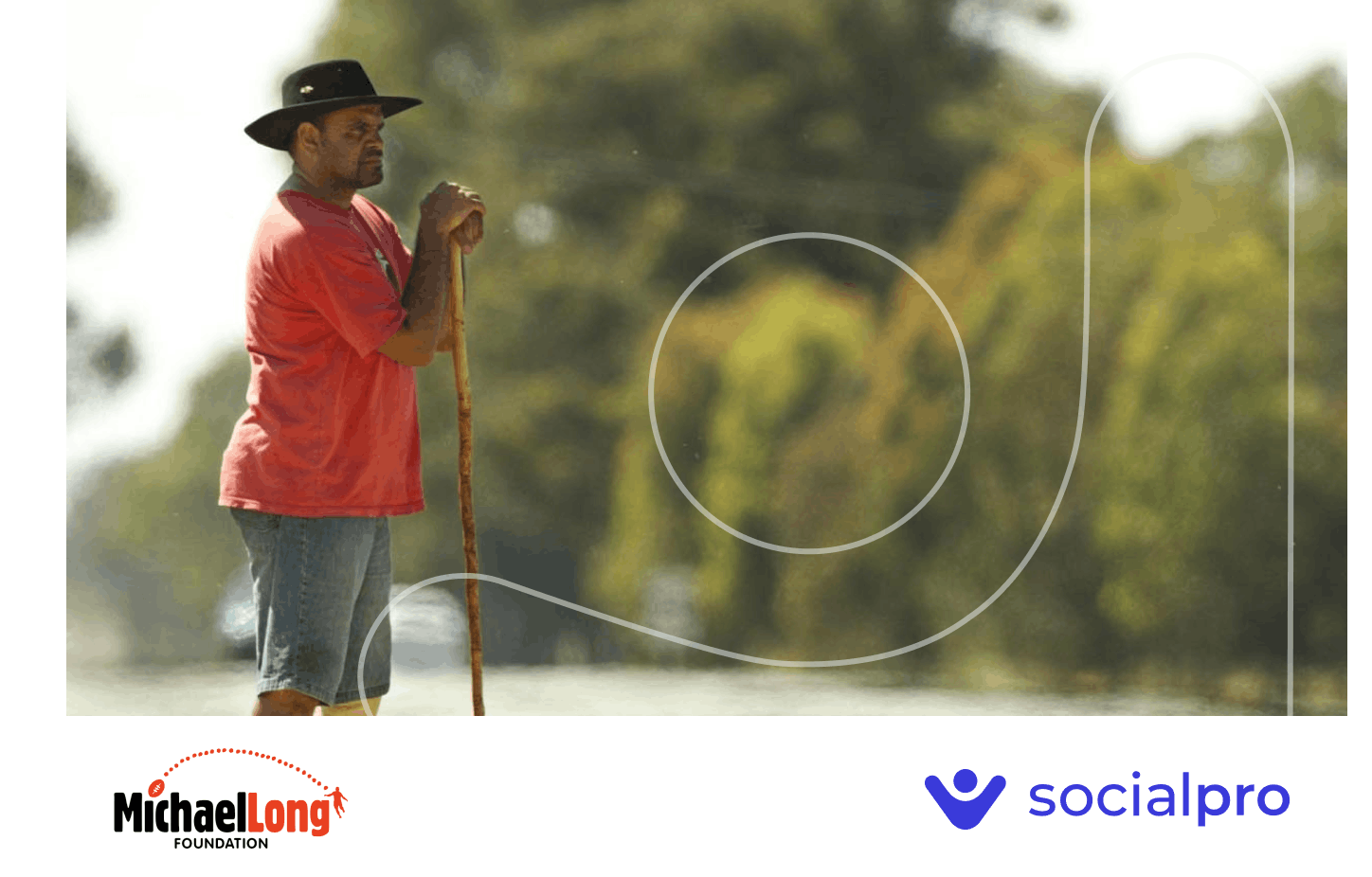 Aboriginal man leaning on a cane and looking off into the distance