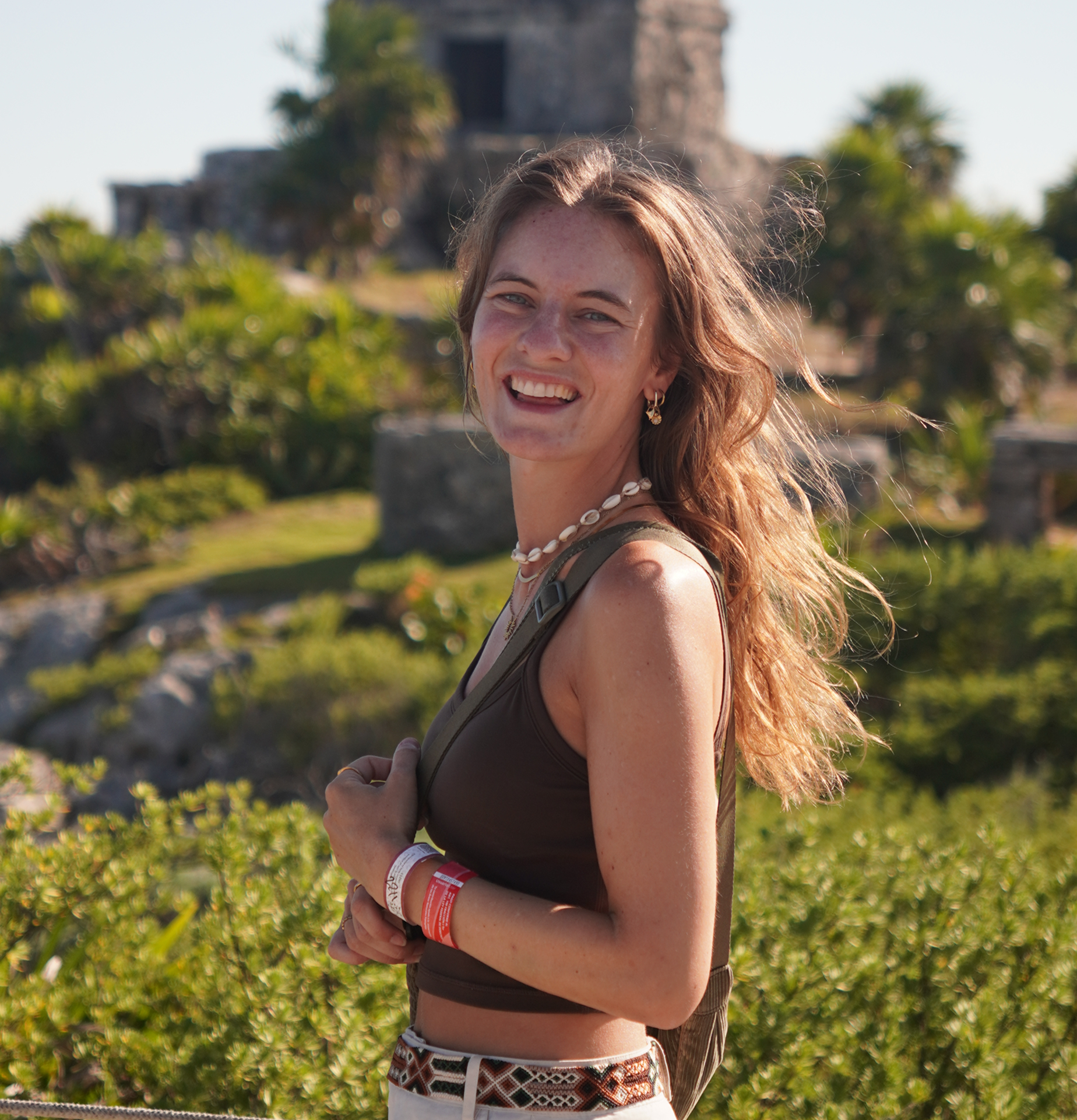 Image of Sandra with tropical background and maya ruins in mexico