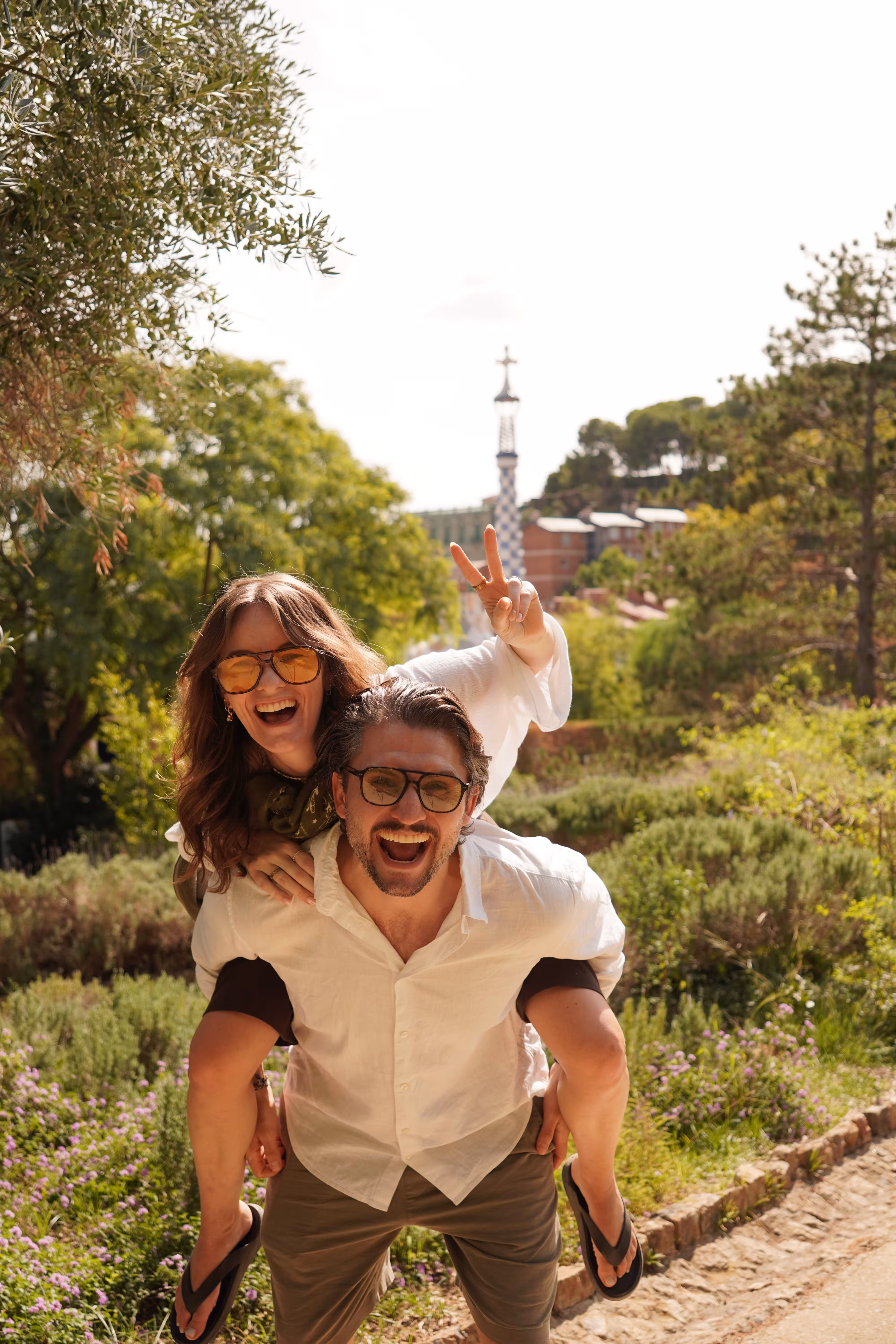 Image of Sascha and Sandra, Selfie, Smiling, with backpacks at the train station