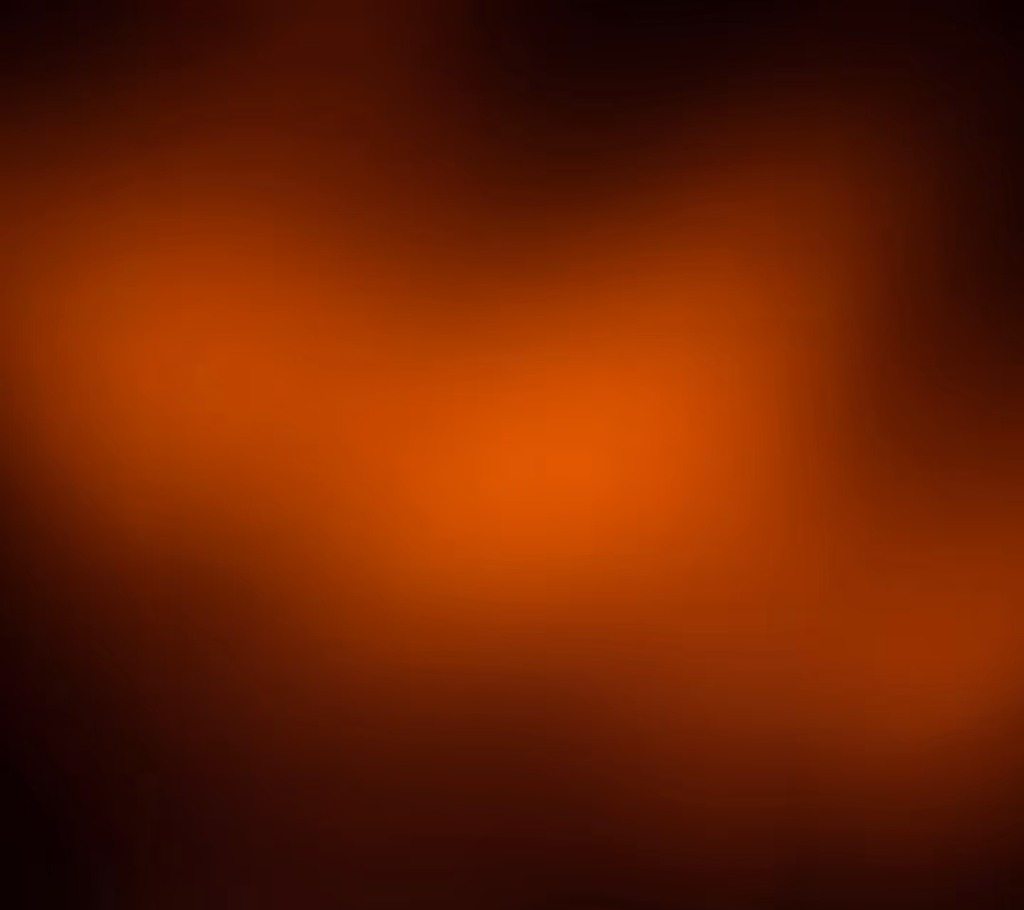Fundo desfocado em tons de laranja e preto criando um efeito de luz suave.
