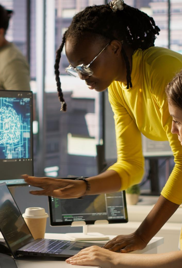 Person mopping a shiny floor near large windows with city view in the background.