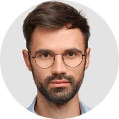 a man with glasses and a beard in a circle