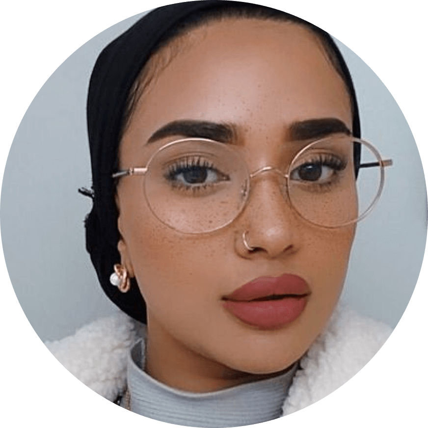A close up of a person wearing glasses.