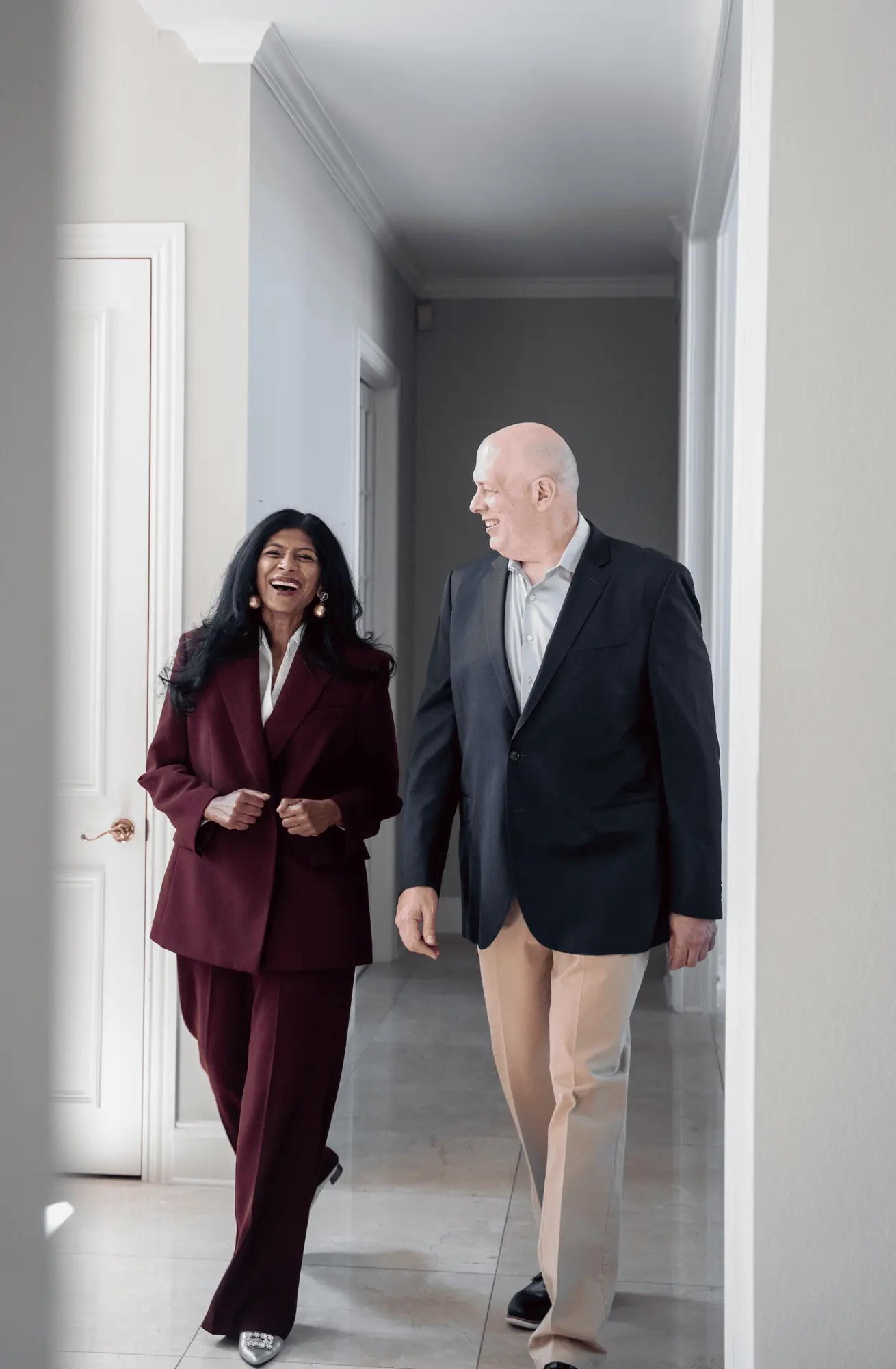 Sandhya and Matthew Johnson walking together during the Ingenium Global brand shoot.