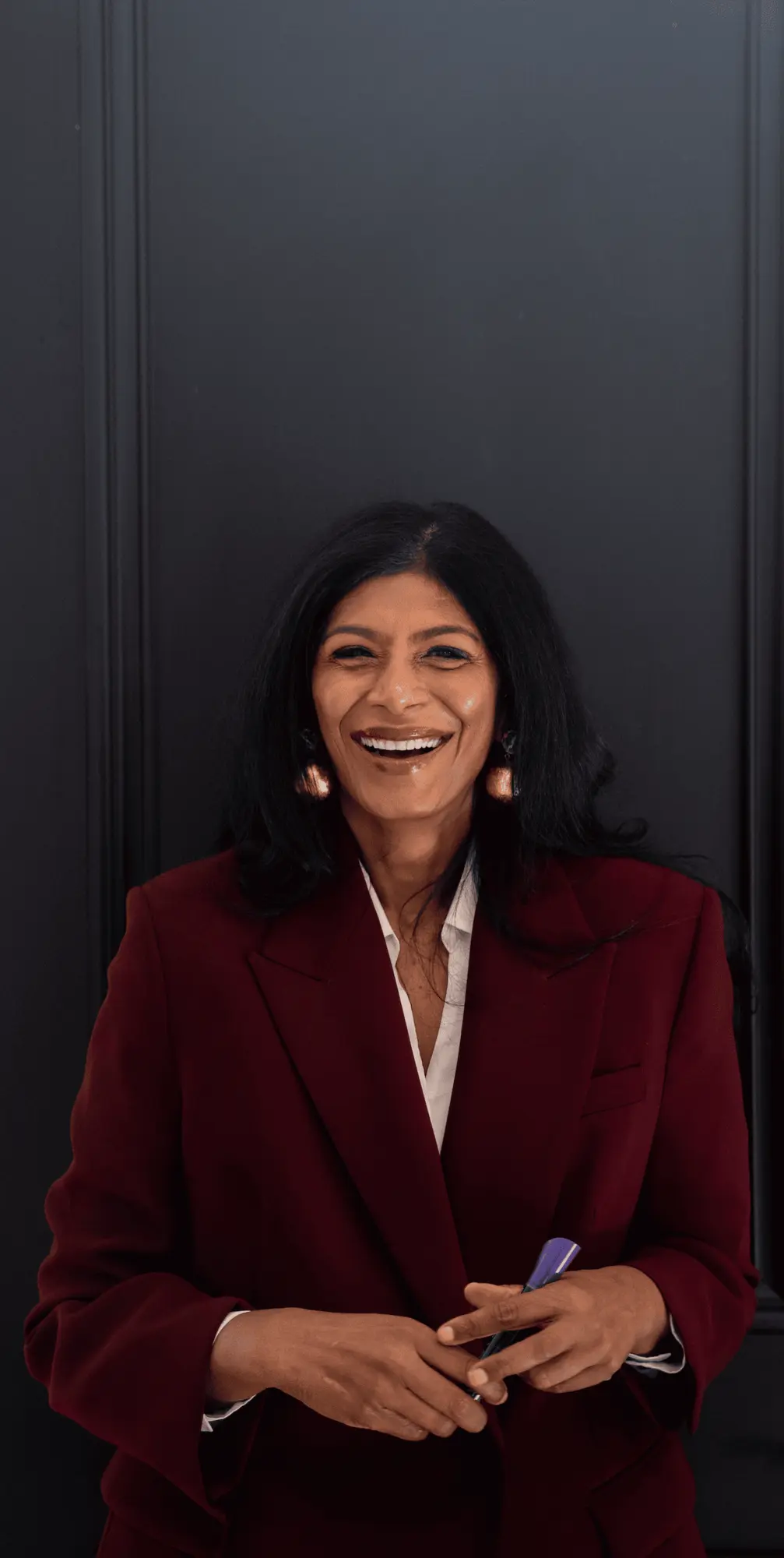 Sandhya Johnson in a professional portrait for Ingenium Global.