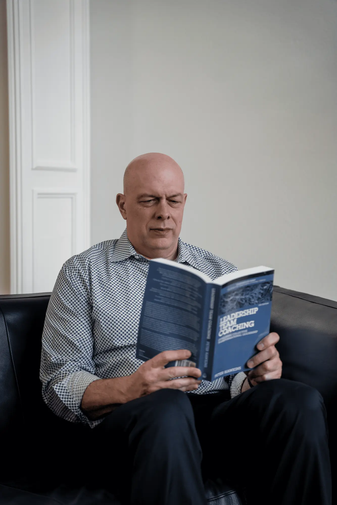 Matthew Johnson reading and reviewing sector research.