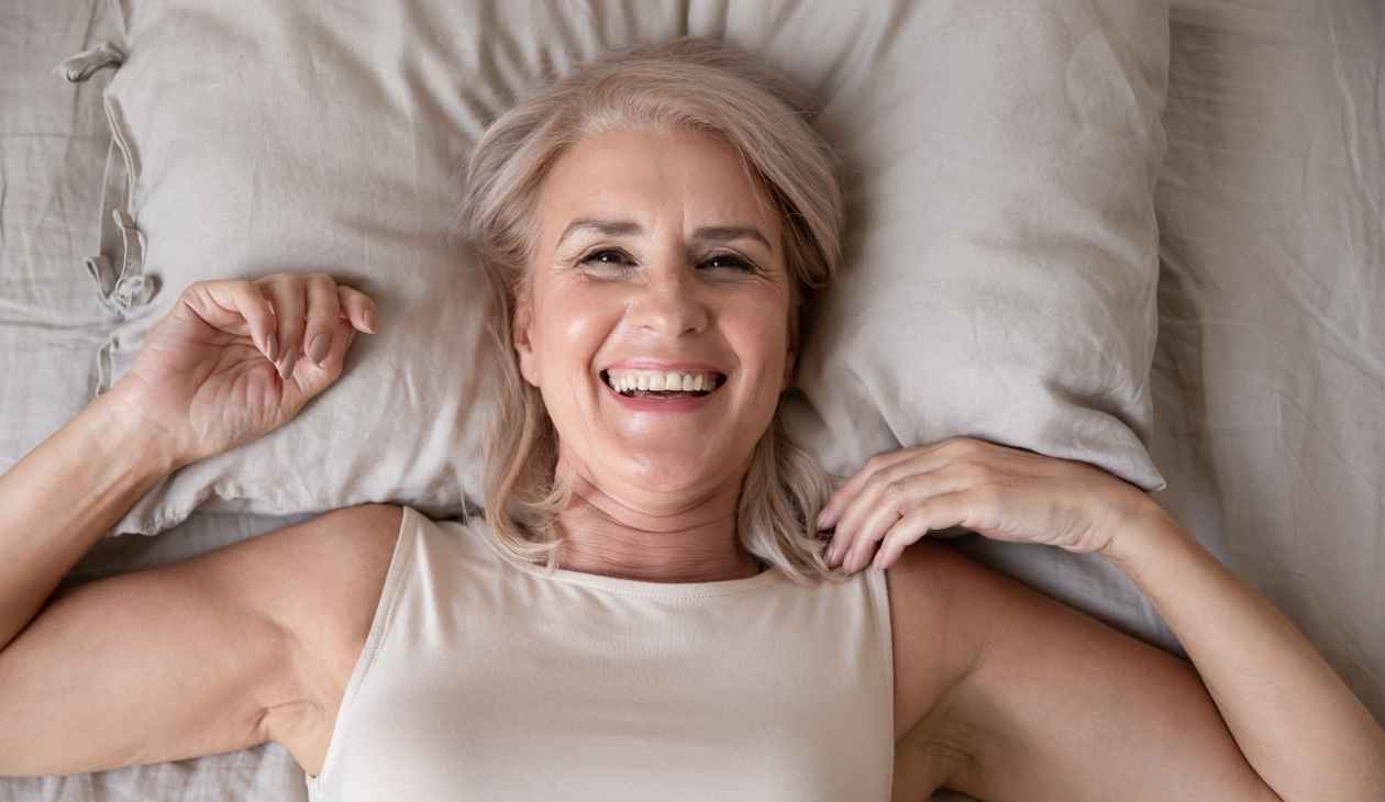 Happy postmenopausal woman who is able to sleep