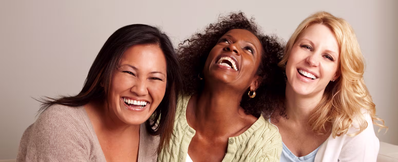 Three smiling perimenopausal woman who sleep well with self-hypnosis