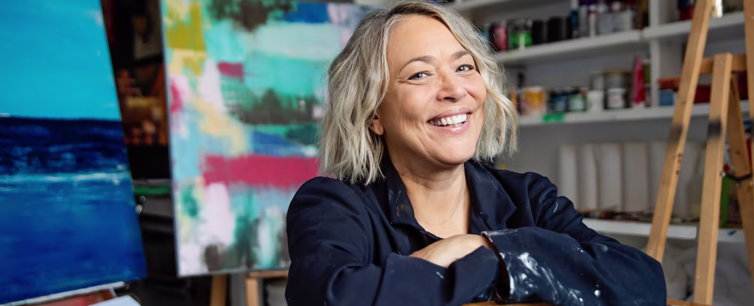 Anxiety-free woman postmenopause in her art studio