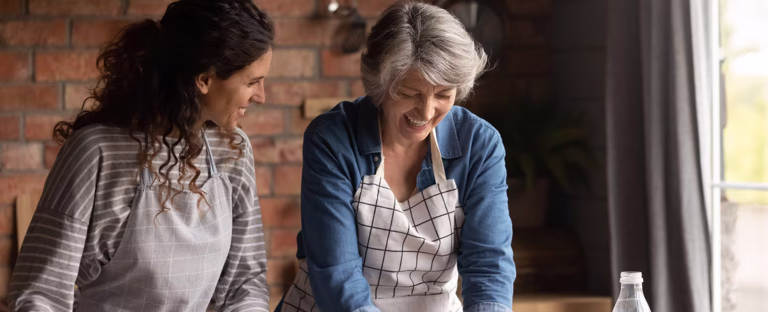 Brain-healthy and focused mother cooking with her daughter and reminiscing memories