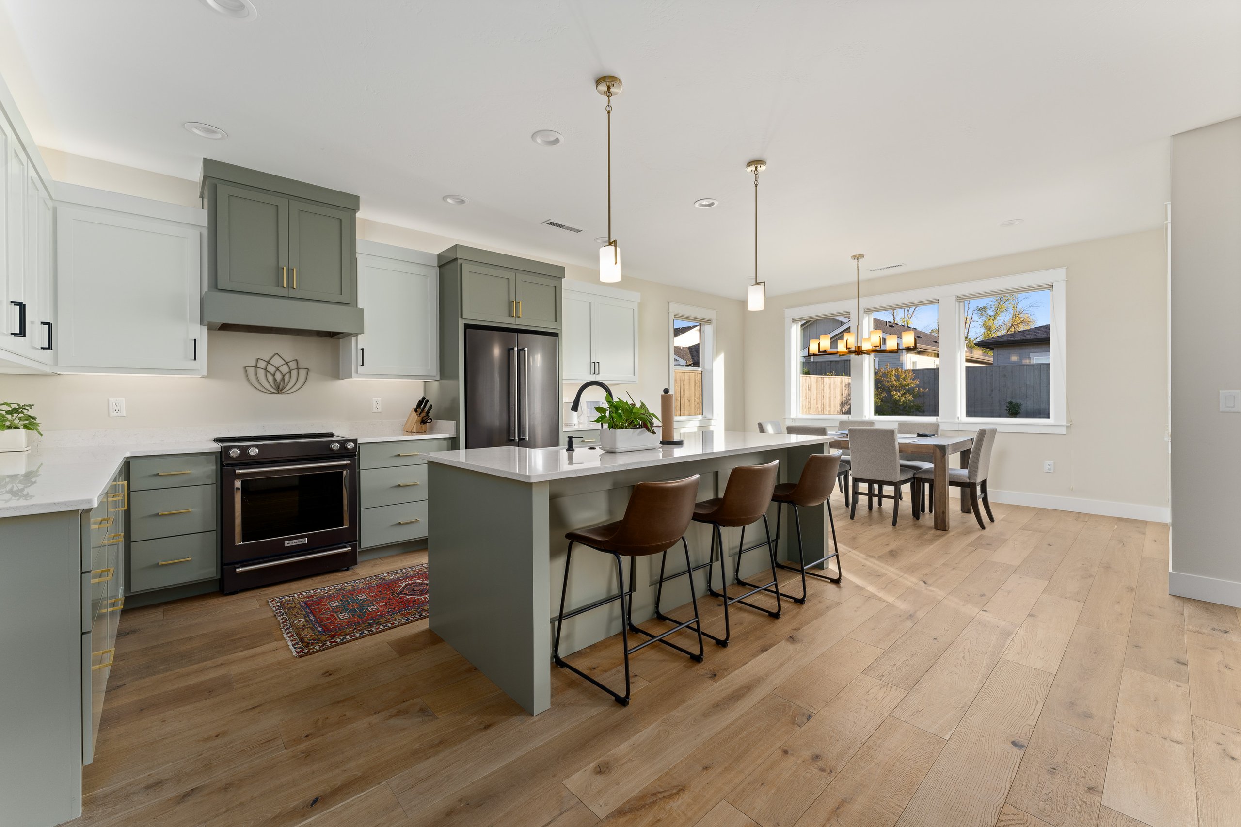 Luxury interior kitchen photography in Medford, Oregon, featuring modern cabinets and lighting.