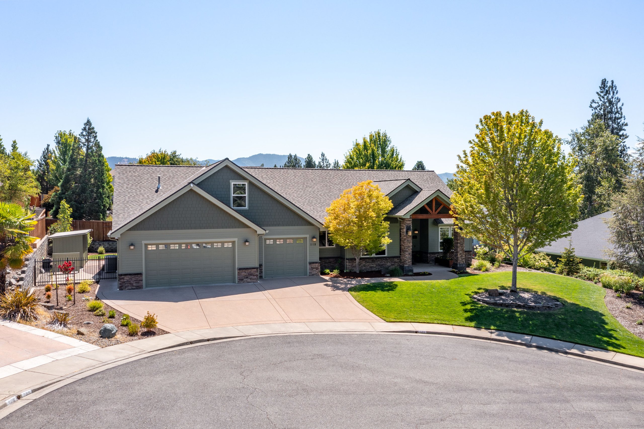 Aerial drone real estate photography of a luxury home in a Southern Oregon neighborhood.