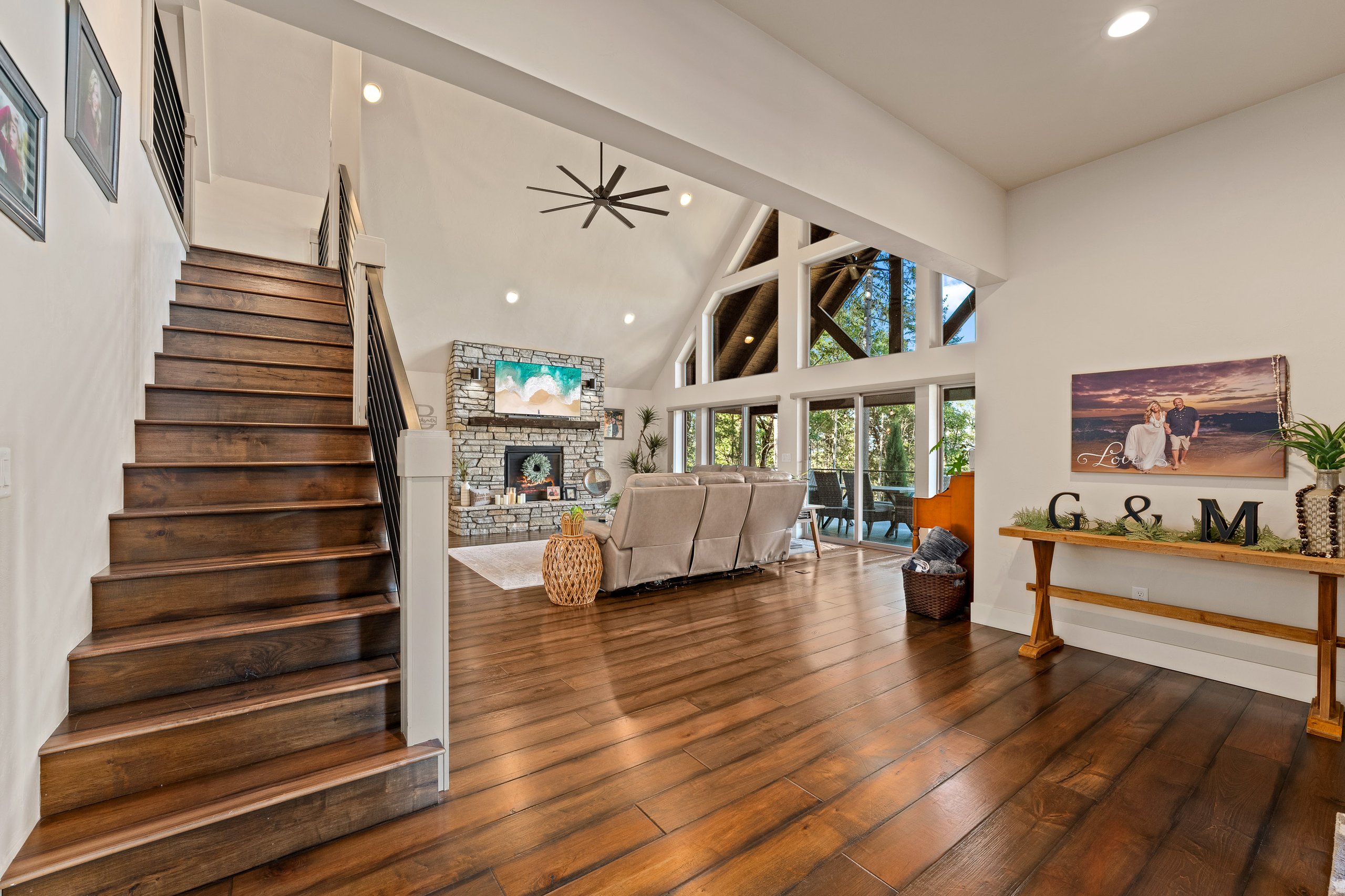 Professional real estate media for properties in Southern Oregon showing a modern living room and staircase.