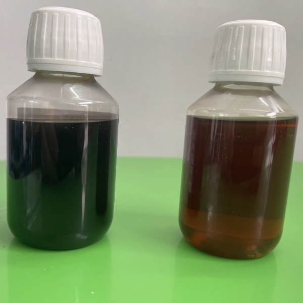 Two small plastic bottles with white caps placed on a green surface containing dark and amber-colored liquids.