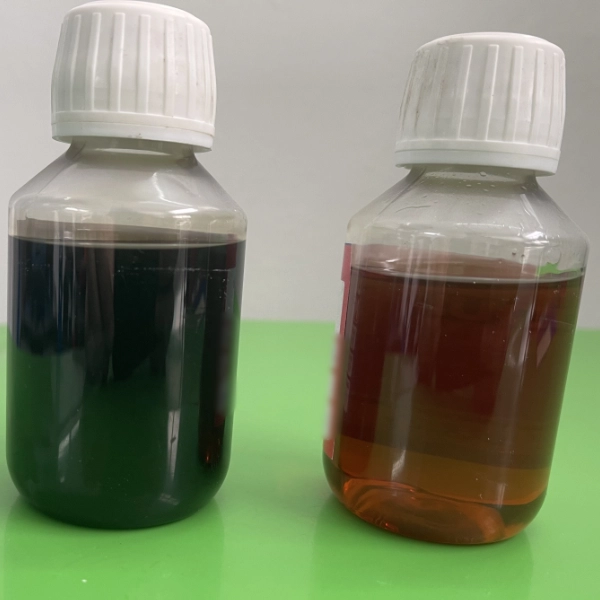 Two clear plastic bottles with white caps containing dark and amber-colored liquids placed on a green surface.