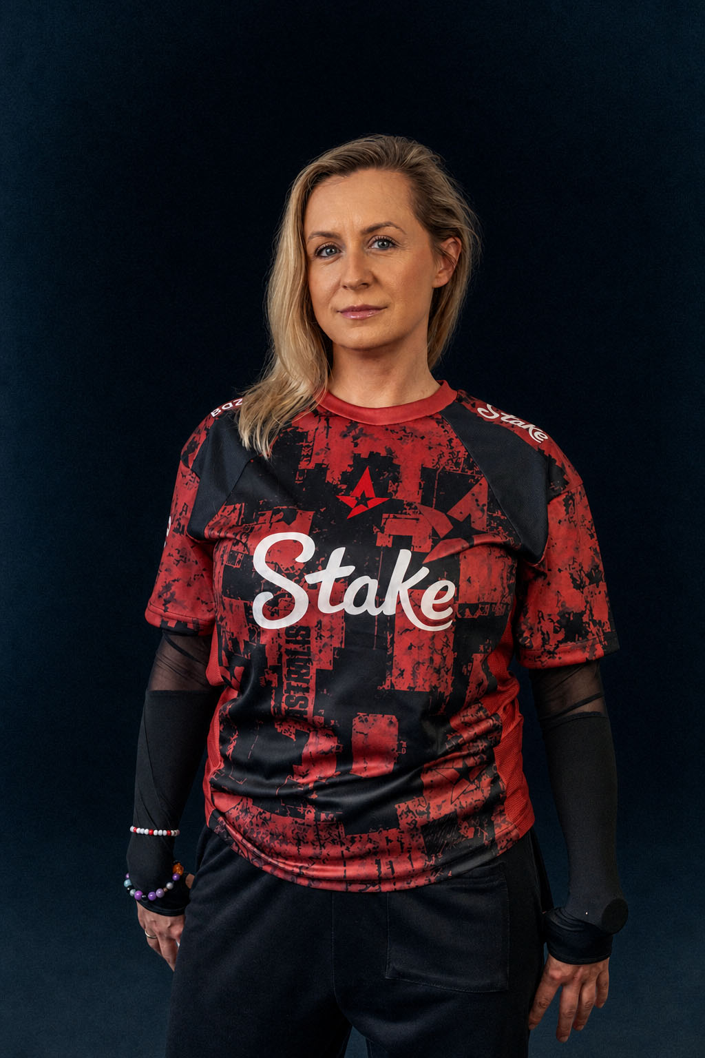 xirreth facing the camera in an Astralis jersey over black mesh sleeves.
