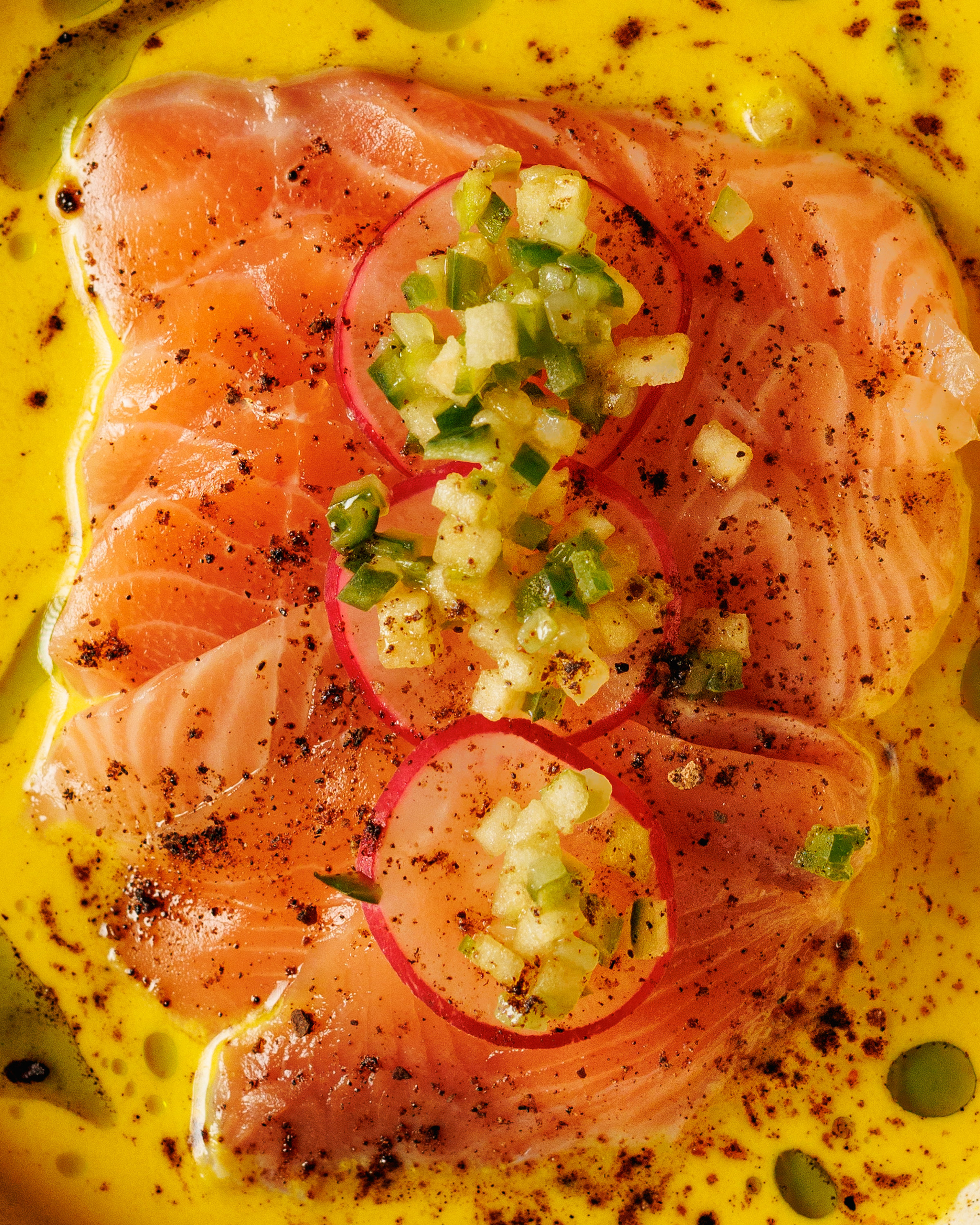 Salmon crudo with passionfruit gazpacho, purple radish and cucumber ezme