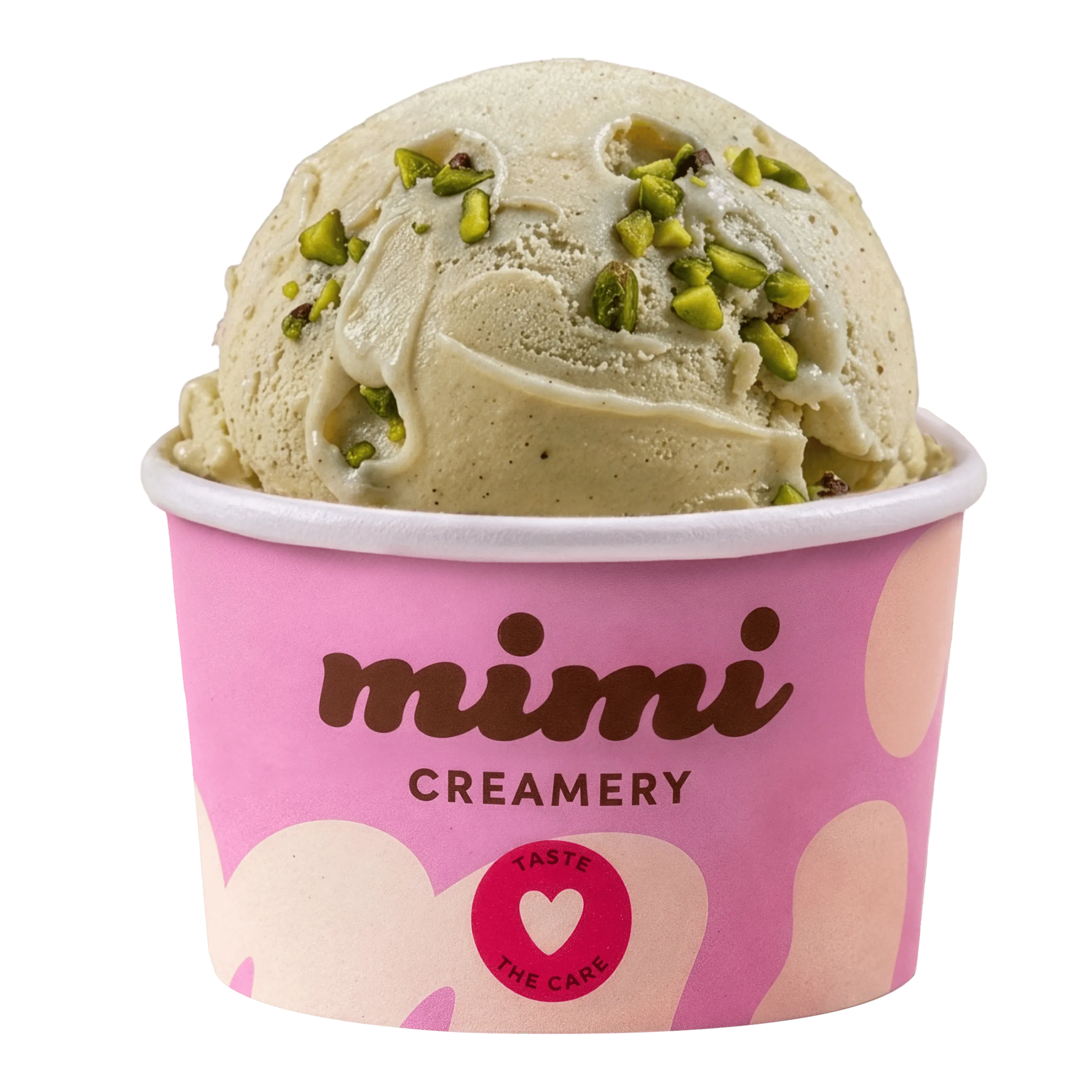 Cup of pistachio ice cream topped with chopped pistachios in a pink Mimi Creamery cup.