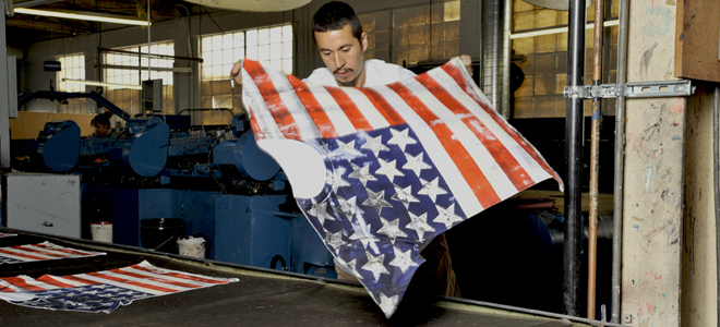 man laying belt printed t-shirt to dry