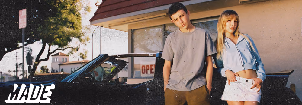 Made Blanks Catalog Image with a young man and woman in front of a car parked next to a fast food spot