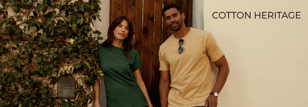 Cotton Heritage catalog image of a man and woman in front of a doorway wearing t-shirts